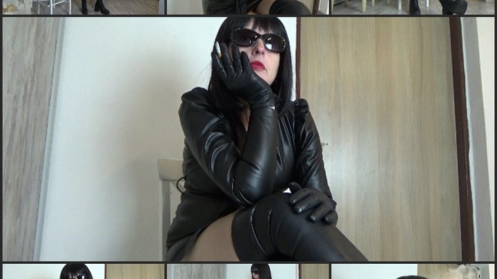 Mistress Angela smokes in a new leather dress