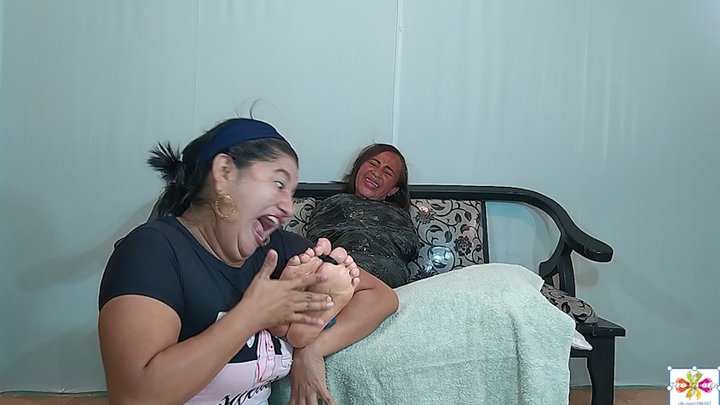 Jesika gets tickled by Ana Maria's hands