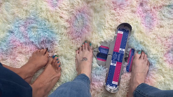 Two Girls Measure Their Big Feet