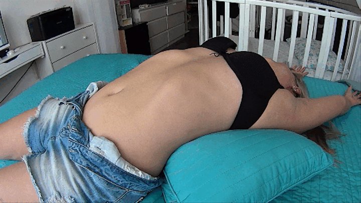 women lie on the bed and stretch their bellies S