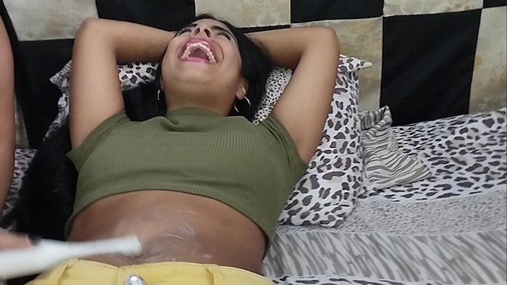 Daniela gets her feet and navel tickled