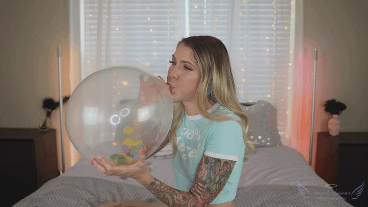 Angel blows up confetti balloons