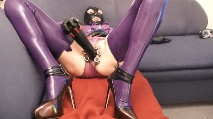 Pierced Latex Doll in transparent knickers, mask and skirt, purple blouse, mask and stockings inserting enormous rubber hand shaped dildo in her vagina masturbating and riding on it PART III