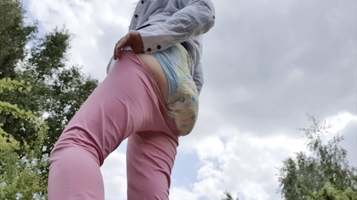 Barebum outdoor diaper wetting in the woods peeing